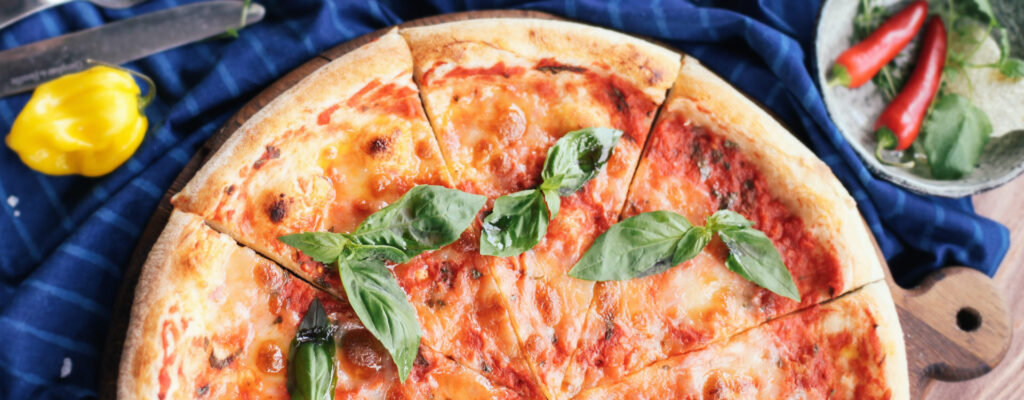 Image of a Margherita pizza on a wooden board