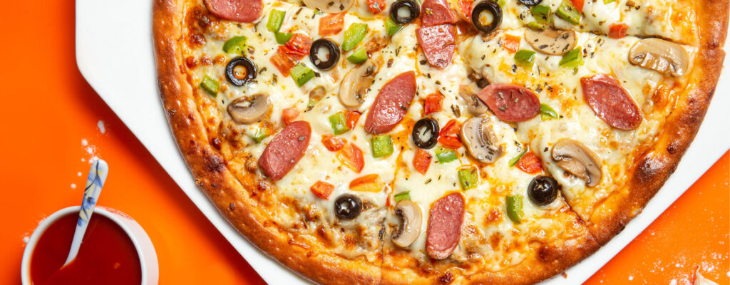 Pizza with toppings and sauce
