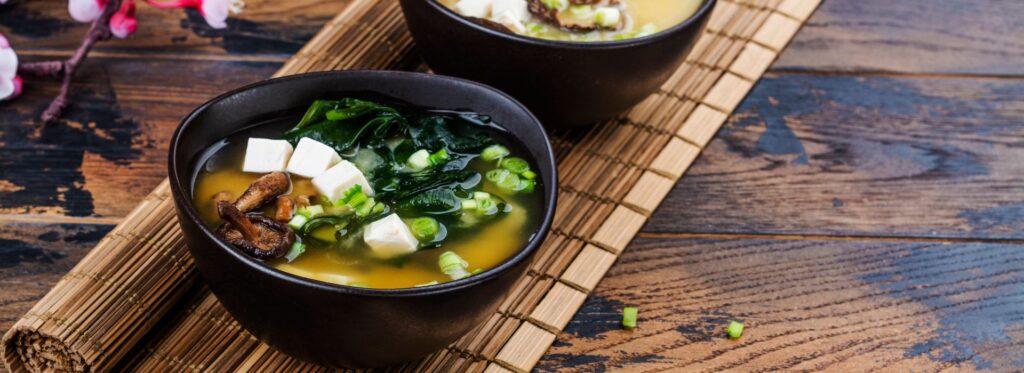 Bowl of Miso Soup set on a wooden table